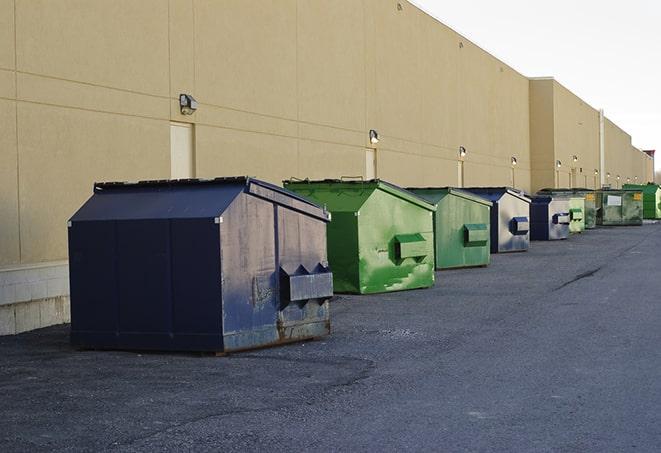 roll-off dumpsters parked at a job site in Crowley